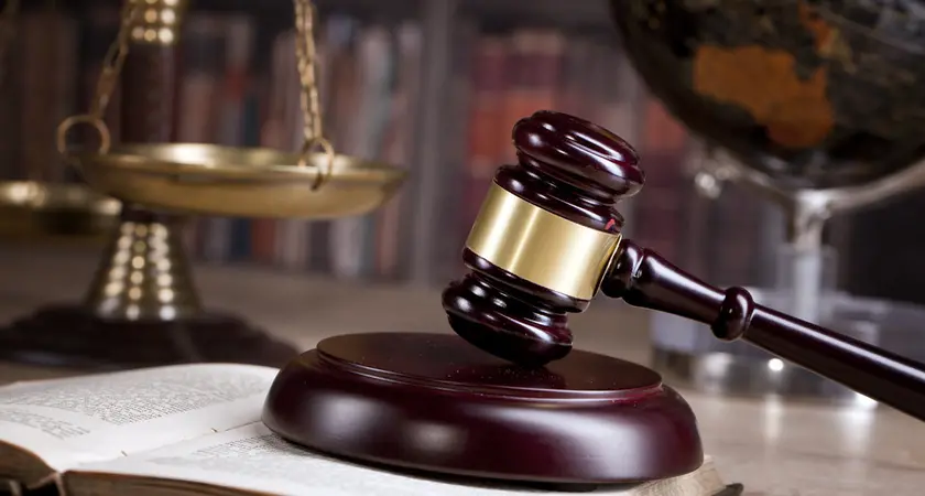 A gavel sitting on a table.