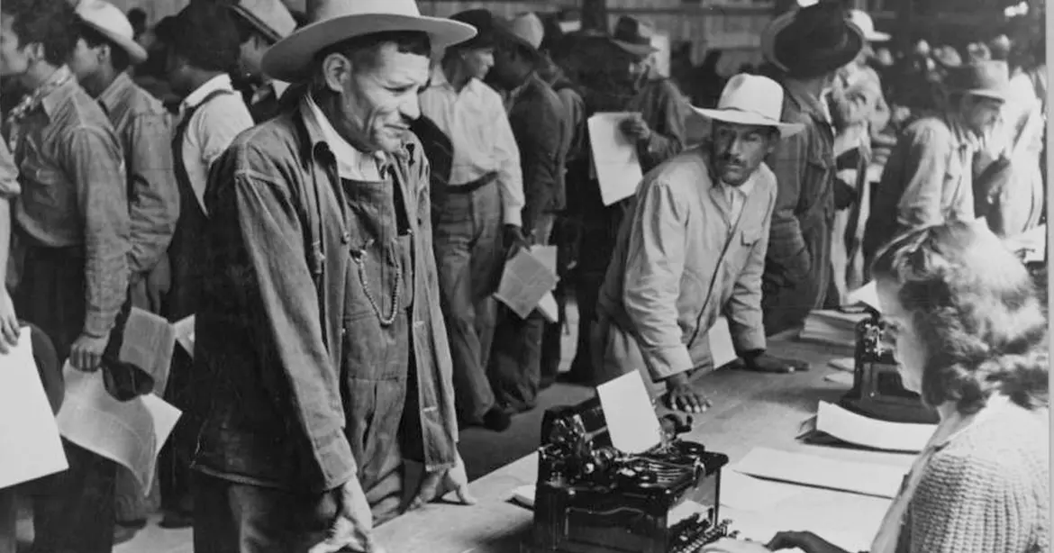 Mexican farm workers line up as they are registered to work in the US through the Bracero program.