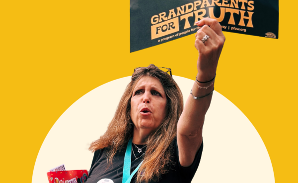Woman holding a sign that reads Grandparents For Truth