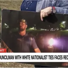 Screenshot of CNN banner stating "Oklahoma Councilman with White Nationalist Ties Faces Recall"