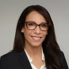 Portrait photo of Katherine Stewart smiling into the camera