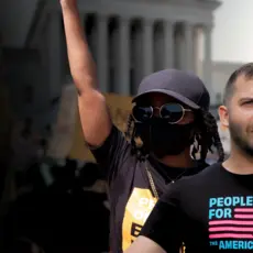 Pictures of people at a protest that reads "the resistance starts now" 