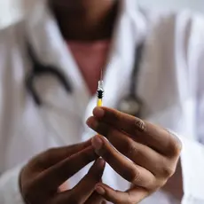 Doctor preparing a vaccine