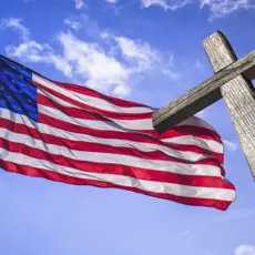 An American flag and a cross.