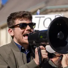 Nick Fuentes with bullhorn at a Stop The Steal rally