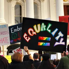 A sign being held at a protest which reads "EQUALITY"