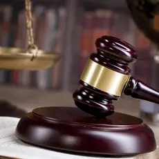 A gavel sitting on a table.