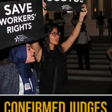 Two women hold signs saying "Save SCOTUS" and "Save workers' rights" outside the Supreme Court with the title Confirmed Judges, Confirmed Fears