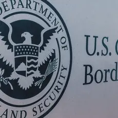 The seal of the U.S. Department of Homeland Security on a sign for U.S. Customs and Border Protection