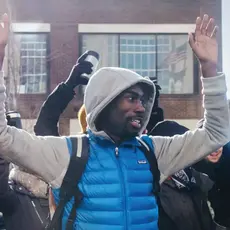 DeRay McKesson raises his hands in the “Hands up, don’t shoot” gesture in the early days of the Ferguson protests.