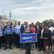 Jen Herrick speaks in front of a group of activists outside the U.S. Capitol Building in support of the Equality Act