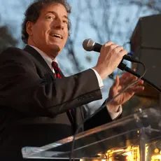 Jamie Raskin stands at a podium and gives a speech