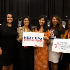 Lizet Ocampo, Sammi Brown, Eloria Diaz, Anna Eskamani, and Summer Lee hold PFAW signs at the 2019 Netroots Nation conference