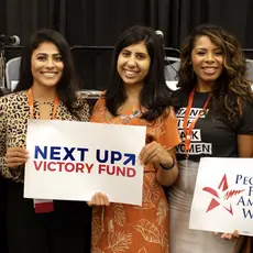 Lizet Ocampo, Sammi Brown, Eloria Diaz, Anna Eskamani, and Summer Lee hold PFAW signs at the 2019 Netroots Nation conference