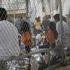 immigrant children crowded together in detention center