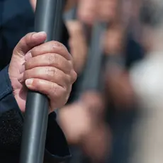 Close up of a police officer holding a baton