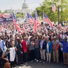 A group of activists pose with American flags