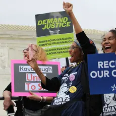 Activists hold signs outside the Supreme Court saying "Kavanaugh: Unfit to Sit," "Reclaim our courts," and "Demand justice: Impeach Kavanaugh"