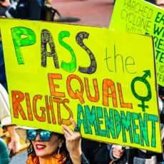 Participant of the 2020 Women's March - San Francisco holds a sign reading "Pass the Equal Rights Amendment!"