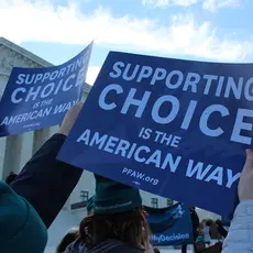 Activists hold signs that say "Supporting Choice is the American Way" at the #MyRightMyDecision rally at the Supreme Court