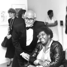 Norman Lear stands next to Barbara Jordan.