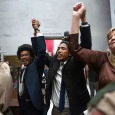 Rep. Justin Pearson, Rep. Justin Jones, Rep. Gloria Johnson People hold their hands up as they exit the House Chamber doors at the Tennessee State Capitol Building