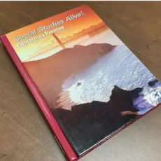 The cover of the Teachers’ Curriculum Institute’s “Social Studies Alive!” fourth-grade textbook is seen. The Temecula school board adopted the curriculum