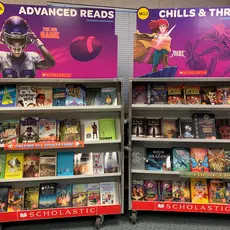 Shelves of books at a Scholastic book fair.