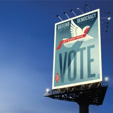 A billboard that says "Vote"