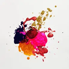 blobs of brightly colored paint on a white surface